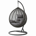 Poltrona pensile in metallo e rattan sintetico grigio con cuscini